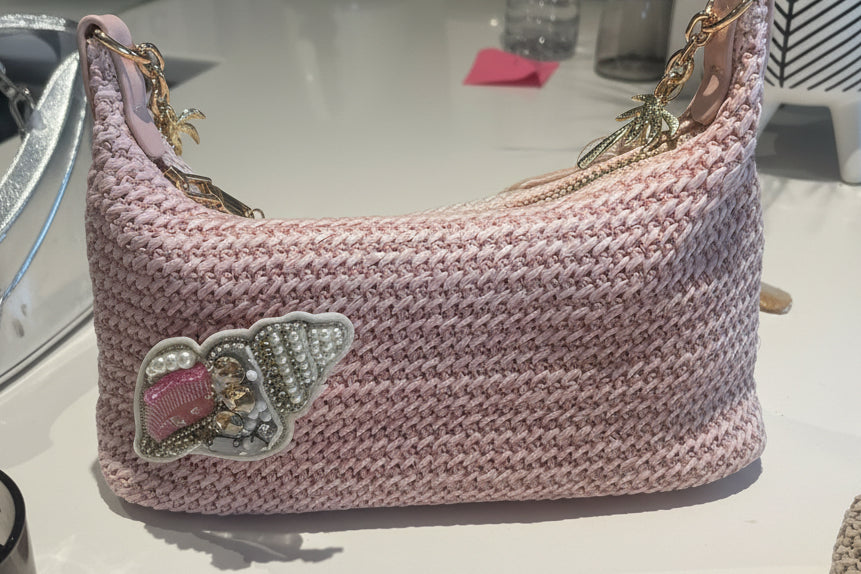 Pink beaded shell charm bag
