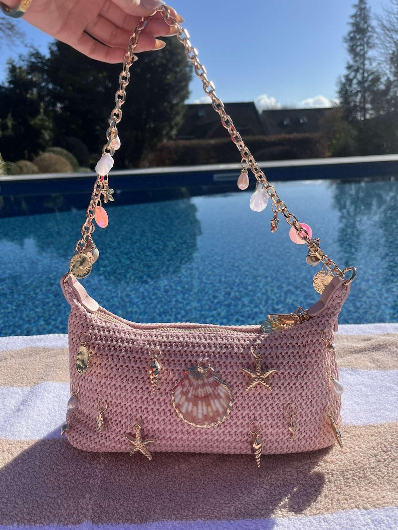 Pink centre shell multi charm bag