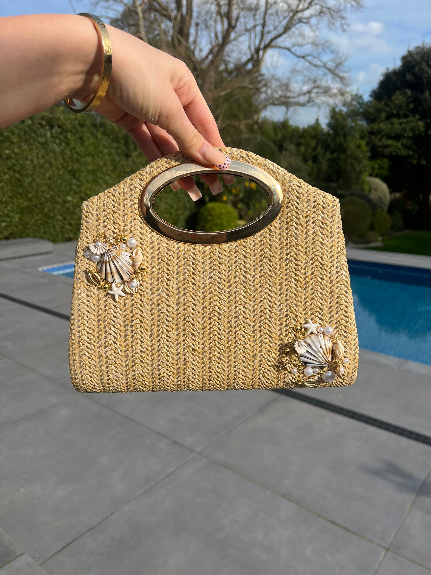 Shell multi charm handbag