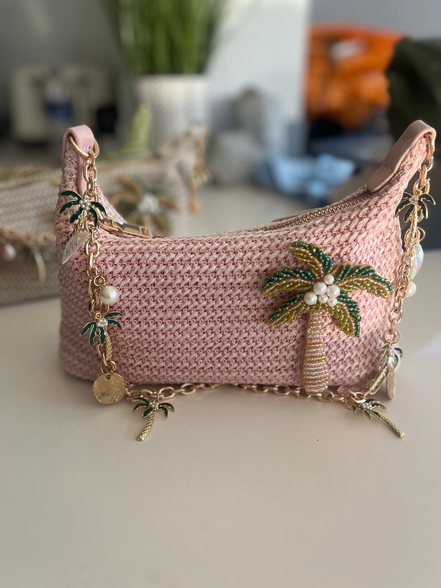 Pink beaded palm tree charm bag