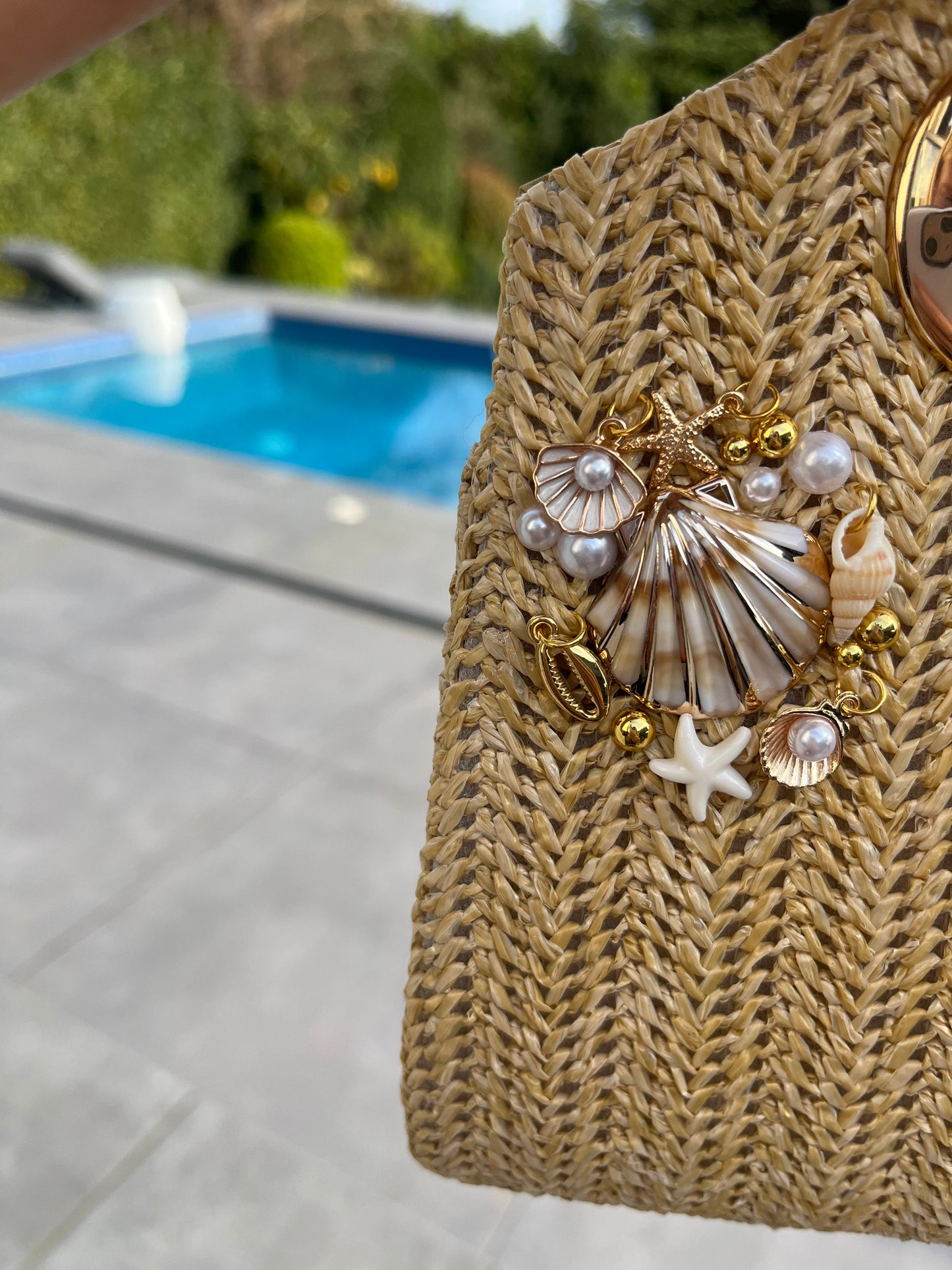 Shell multi charm handbag