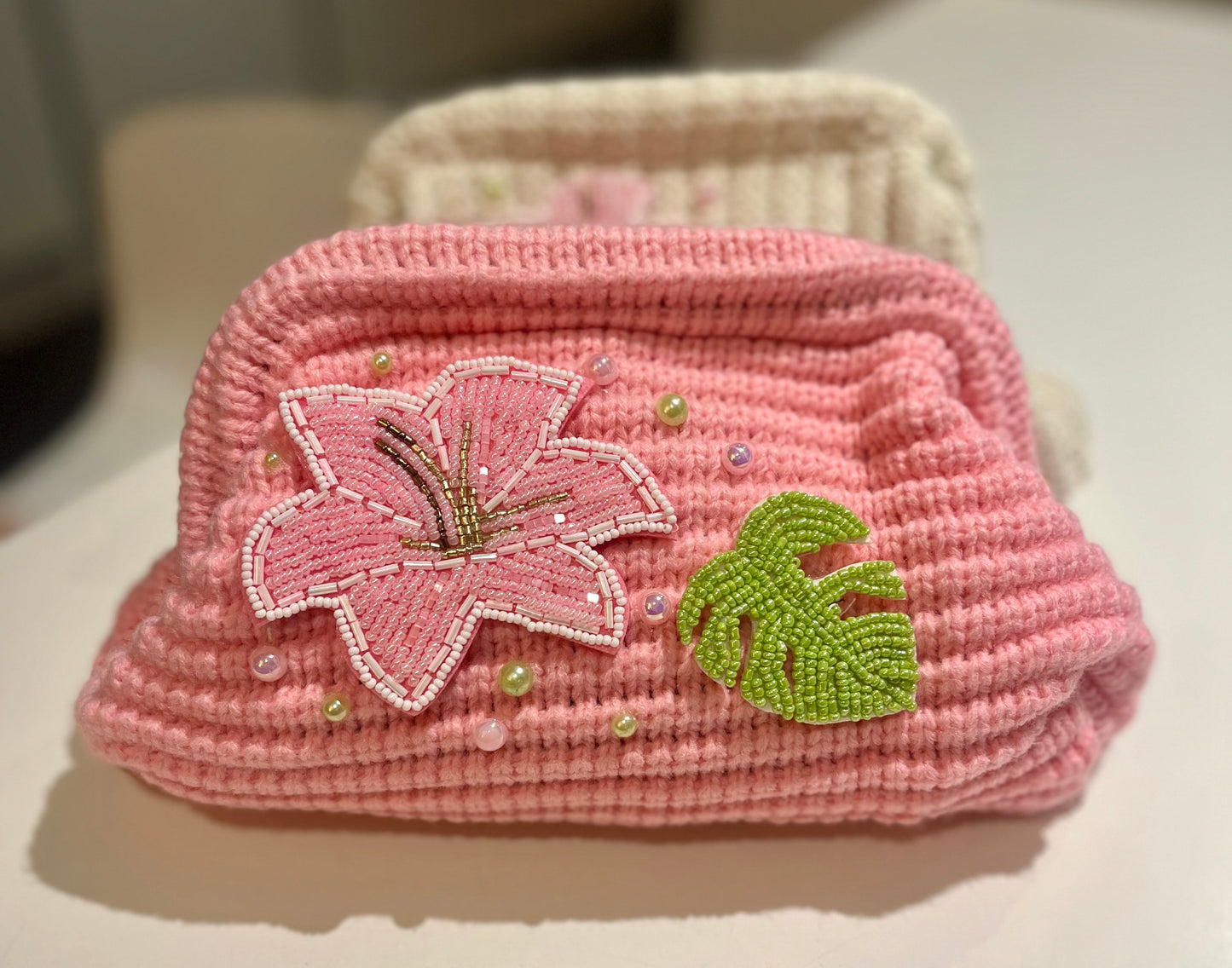 Pink beaded flora & leaf clutch bag