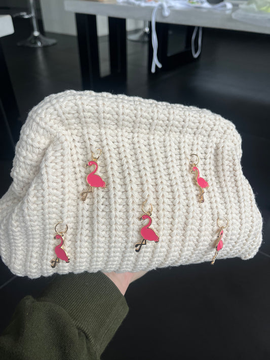 Crème Flamingo charm clutch bag