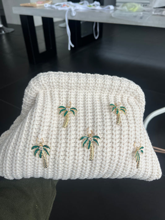 Crème Palm tree charm clutch bag