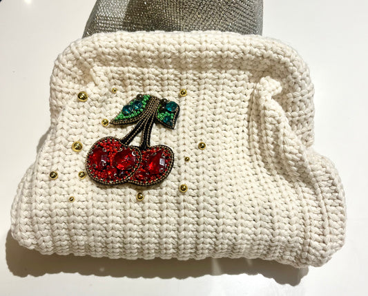 Crème Gem cherry clutch bag