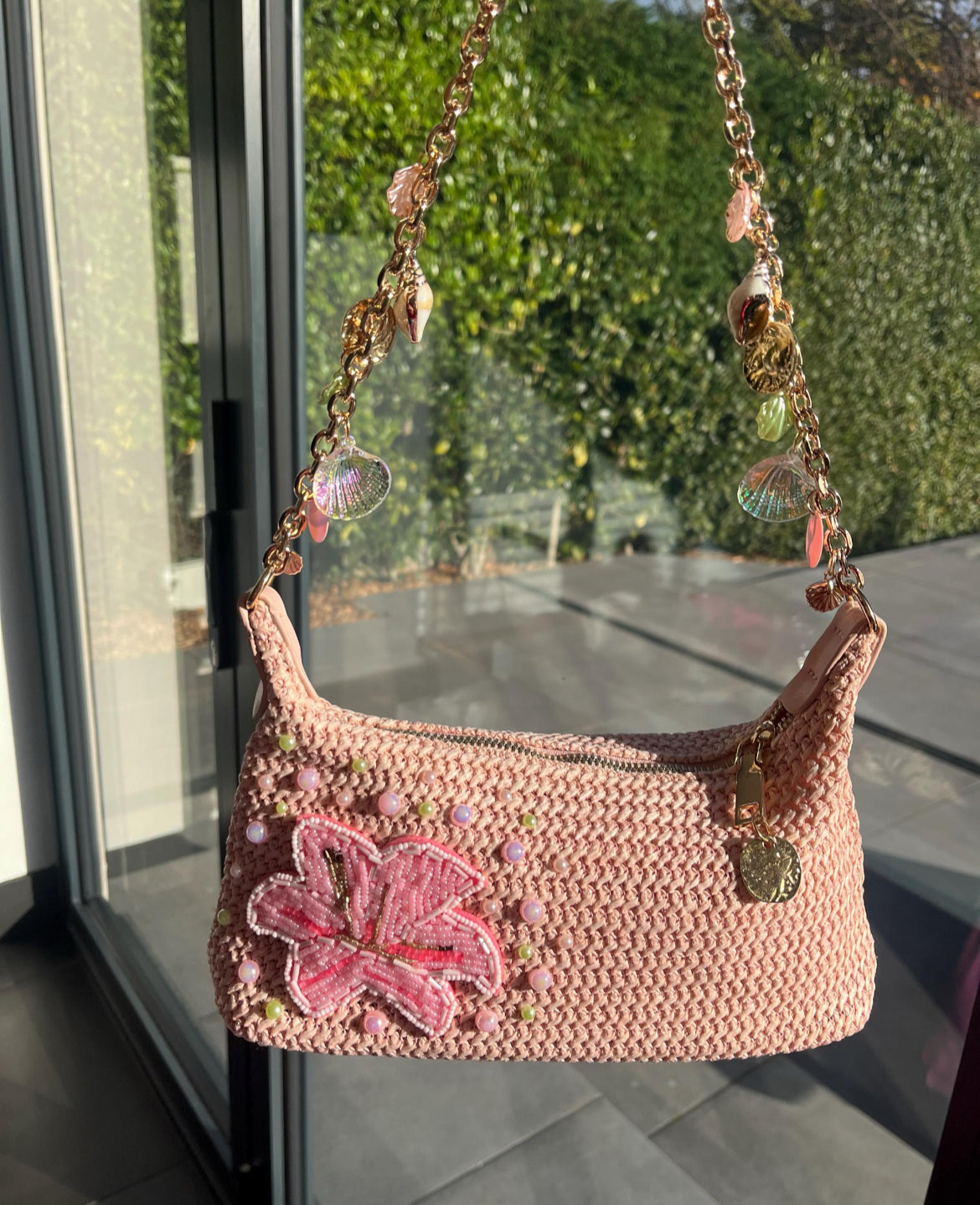 Pink beaded flora charm bag