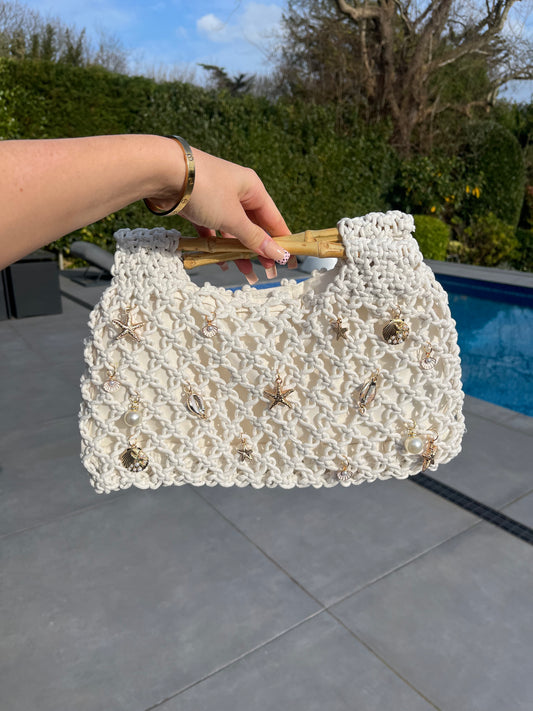 White woven charm bag