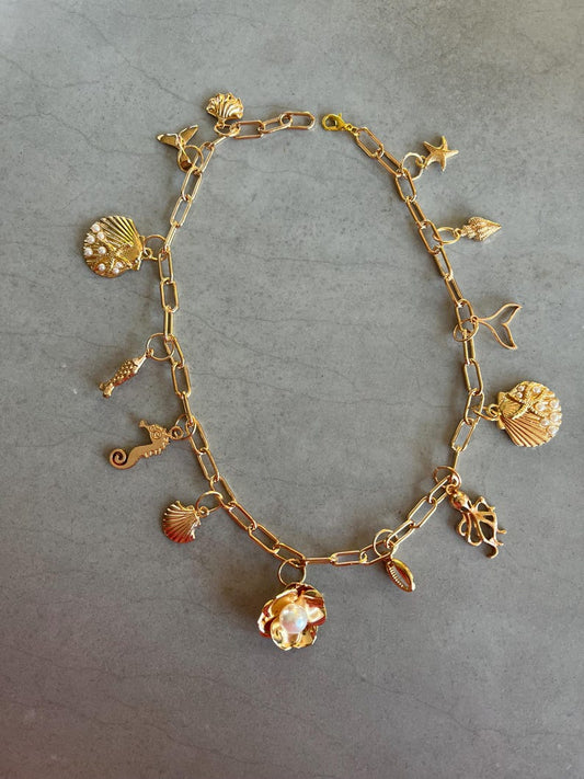 Gold flower charm necklace