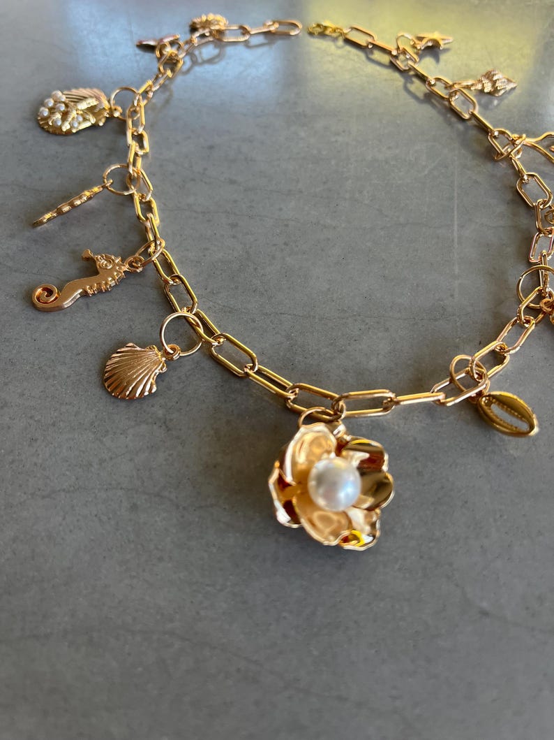 Gold flower charm necklace