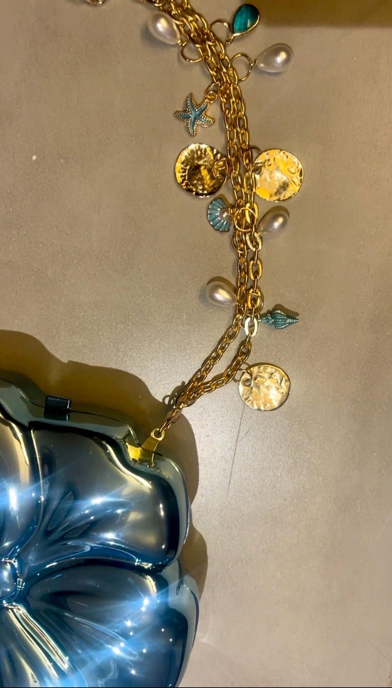 Blue flora hard shell charm bag