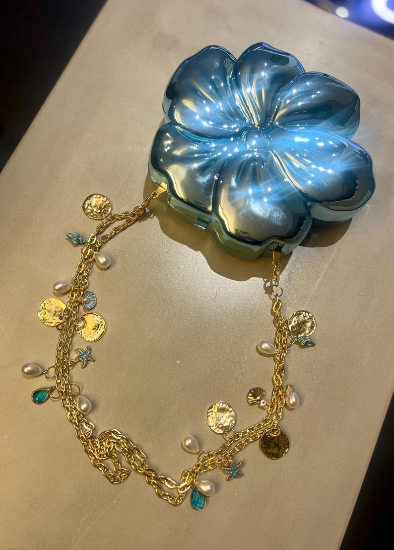 Blue flora hard shell charm bag