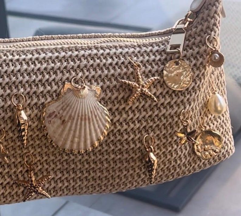 Beige centre shell charm bag