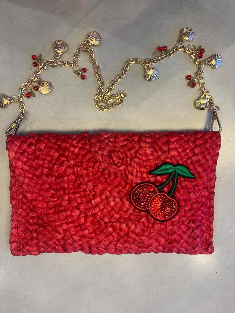 Red sequin cherry bay charm bag